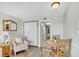 Living room with light walls, a plush chair, a table, and hardwood-style flooring at 6804 N Ocean Blvd. # 533, Myrtle Beach, SC 29572