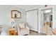 Living room area with light-colored walls, a plush chair, and an entrance to other rooms at 6804 N Ocean Blvd. # 533, Myrtle Beach, SC 29572