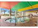 Relax by the pool with colorful ceilings and palm trees creating a great outdoor tropical getaway at 6804 N Ocean Blvd. # 533, Myrtle Beach, SC 29572