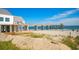 Beach view of a wooden pier extending over the ocean, supported by concrete pillars at 694 Harrison Mill St., Myrtle Beach, SC 29579