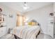 Cozy bedroom featuring a bed with a decorative headboard and a ceiling fan at 694 Harrison Mill St., Myrtle Beach, SC 29579