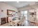 Elegant dining room with a large table, wine rack, and view of the lake at 694 Harrison Mill St., Myrtle Beach, SC 29579