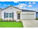 Charming single-Gathering home with a well-manicured lawn, two-car garage, and inviting front entrance at 694 Harrison Mill St., Myrtle Beach, SC 29579