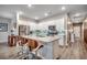 Contemporary kitchen with white cabinets, stainless steel appliances, island with seating, open to living areas at 694 Harrison Mill St., Myrtle Beach, SC 29579