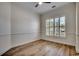 Comfortable bedroom features plantation shutters, neutral paint, and laminate floors at 726 Carolina Farms Blvd., Myrtle Beach, SC 29579