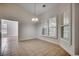 Cozy dining area with tile flooring, chandelier, and plantation shutters at 726 Carolina Farms Blvd., Myrtle Beach, SC 29579