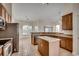 Open kitchen featuring a center island, stainless steel appliances, and breakfast bar at 726 Carolina Farms Blvd., Myrtle Beach, SC 29579