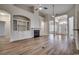 Spacious living room featuring a fireplace, built-in shelving, and wood-look flooring at 726 Carolina Farms Blvd., Myrtle Beach, SC 29579