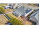 Aerial view of a home with a fenced backyard, a sunroom, and solar panels on the roof at 726 Carolina Farms Blvd., Myrtle Beach, SC 29579