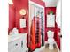 Bathroom features a London phone booth shower curtain, and a white vanity at 7609 Brentwood Dr., Myrtle Beach, SC 29572