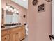 Bright bathroom with a granite vanity top, elegant lighting and modern fixtures at 7609 Brentwood Dr., Myrtle Beach, SC 29572