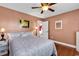 Bedroom with hardwood floors, ceiling fan, and stylish decor at 7609 Brentwood Dr., Myrtle Beach, SC 29572