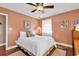 A cozy bedroom featuring hardwood floors, soft lighting, and a ceiling fan at 7609 Brentwood Dr., Myrtle Beach, SC 29572