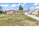 Brick house with a well-maintained lawn and a curved driveway leading to an attached one-car garage at 7609 Brentwood Dr., Myrtle Beach, SC 29572