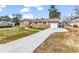 Charming brick home featuring an attached garage and a well-manicured front yard under a sunny sky at 7609 Brentwood Dr., Myrtle Beach, SC 29572