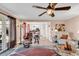 Comfortable living room with a ceiling fan, a view into the kitchen and sliding glass doors to the backyard at 7609 Brentwood Dr., Myrtle Beach, SC 29572