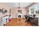 Office featuring a fireplace, chandelier, and plenty of natural light from a large window at 7609 Brentwood Dr., Myrtle Beach, SC 29572