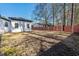 Large backyard featuring a privacy fence and detached buildings at 8533 Cedar Trace Dr., Myrtle Beach, SC 29588