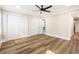 Bright bedroom features wood-look flooring, ceiling fan and large closet space at 8533 Cedar Trace Dr., Myrtle Beach, SC 29588