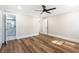 A bright bedroom with wood-look flooring leads to ensuite bathroom at 8533 Cedar Trace Dr., Myrtle Beach, SC 29588