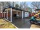 Detached garage with covered patio area and golf cart parked next to it at 8533 Cedar Trace Dr., Myrtle Beach, SC 29588