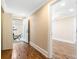 Hallway with wood-look floors leads to bonus room and bedroom at 8533 Cedar Trace Dr., Myrtle Beach, SC 29588