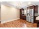 Bright eat-in kitchen with chandelier, stainless steel appliances, and wood flooring at 8533 Cedar Trace Dr., Myrtle Beach, SC 29588