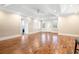 Bright living room with hardwood floors, recessed lighting, and ample natural light from the front door and windows at 8533 Cedar Trace Dr., Myrtle Beach, SC 29588