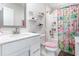 Bright bathroom with whimsical shower curtain, sleek vanity, and stylish fixtures at 9000 Mabel Ct., Longs, SC 29568