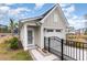 View of a detached garage exterior showcasing traditional style and manicured landscaping at 9000 Mabel Ct., Longs, SC 29568