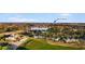 Golf course community aerial view showcases the greens, course, and Myrtle Beach in the distance at 100 Cypress Point Ct. # 105, Myrtle Beach, SC 29579