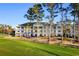 Aerial view of property featuring a spacious backyard, perfect for outdoor activities and relaxation at 100 Cypress Point Ct. # 105, Myrtle Beach, SC 29579