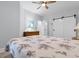 Bedroom showcasing a decorative dresser and a comfy queen-sized bed with a floral-patterned quilt at 100 Cypress Point Ct. # 105, Myrtle Beach, SC 29579