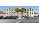 Attractive building with palm trees and parking spaces in front of the building at 100 Cypress Point Ct. # 105, Myrtle Beach, SC 29579