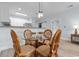 Dining area features a glass-top table with seating for four, next to the kitchen at 100 Cypress Point Ct. # 105, Myrtle Beach, SC 29579