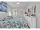 Bright bedroom with a ceiling fan, a window with shutters, and beach-themed decorations at 1016 Longwood Bluffs Circle, Murrells Inlet, SC 29576