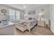 Well-lit bedroom featuring a decorative ceiling fan, coastal decor, and ample natural light at 1016 Longwood Bluffs Circle, Murrells Inlet, SC 29576