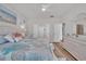 Spacious bedroom featuring coastal decorations, white furniture, and a decorative ceiling fan at 1016 Longwood Bluffs Circle, Murrells Inlet, SC 29576