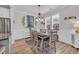 Dining area featuring a stylish table and chairs under an elegant chandelier at 1016 Longwood Bluffs Circle, Murrells Inlet, SC 29576