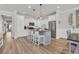 Bright kitchen featuring white cabinetry, a center island with barstool seating at 1016 Longwood Bluffs Circle, Murrells Inlet, SC 29576