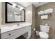 Clean bathroom featuring a vanity with storage, a well-lit mirror, and a toilet with neatly folded towels at 107 S Ocean Blvd. # 602, Myrtle Beach, SC 29577