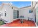 Cozy back patio with red painted wood deck and white siding, perfect for relaxing or entertaining outdoors at 109 Deer Tree Dr., Murrells Inlet, SC 29576