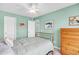 Guest bedroom with a double bed, ceiling fan, and light green paint at 109 Deer Tree Dr., Murrells Inlet, SC 29576