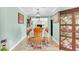 Formal dining room featuring wood floors, a wooden table, and a decorative china cabinet at 109 Deer Tree Dr., Murrells Inlet, SC 29576