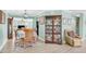 Elegant dining room with wood floors, a wooden table, and a decorative china cabinet at 109 Deer Tree Dr., Murrells Inlet, SC 29576