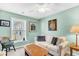 Charming living room with a sofa, lamp, and decoratively painted green walls at 109 Deer Tree Dr., Murrells Inlet, SC 29576