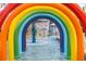 A view through the colorful rainbow arches in the ' water park, offering a delightful and playful vacation escape at 1105 S Ocean Blvd. # 706, Myrtle Beach, SC 29577