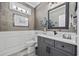 Stylish powder room with wainscoting, granite counters, modern fixtures, and decorative accents at 1109 Wigeon Dr., Conway, SC 29526