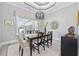 Elegant dining room with a modern light fixture and large window at 1109 Wigeon Dr., Conway, SC 29526