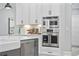 Bright kitchen featuring stainless steel ovens and white shaker style cabinets at 1109 Wigeon Dr., Conway, SC 29526